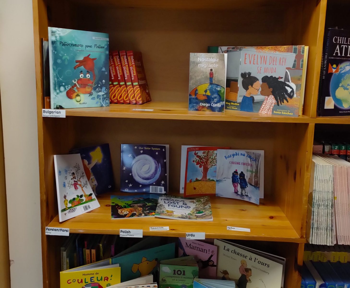 A photo of some shelving holding a variety of different books.